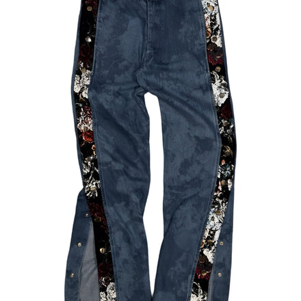 Blue jeans with decorative floral side panels.