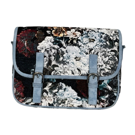 Floral patterned messenger bag with light blue straps and buckles.