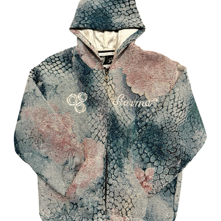 A hooded jacket featuring a snakeskin-like pattern with teal, grey, and pink hues.