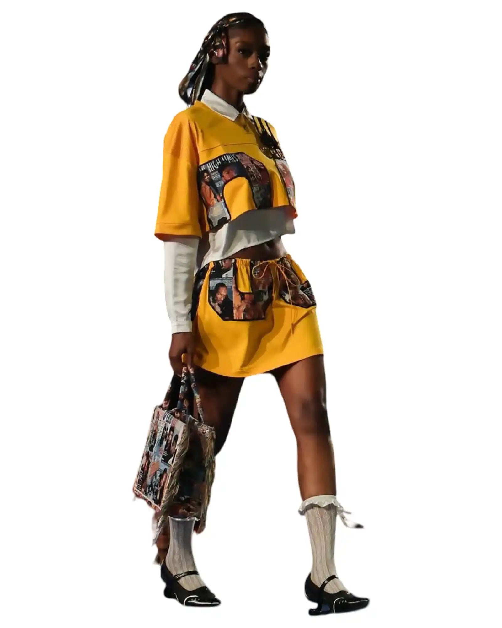 Yellow cropped shirt and matching mini skirt ensemble with printed panels.