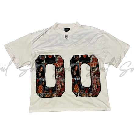 White t-shirt with large ’00’’ numbers filled with colorful patterns.