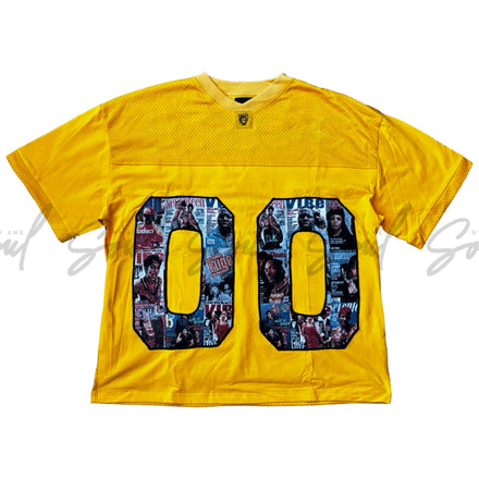 Yellow t-shirt with ’00’’ printed in a colorful, graffiti-style design.