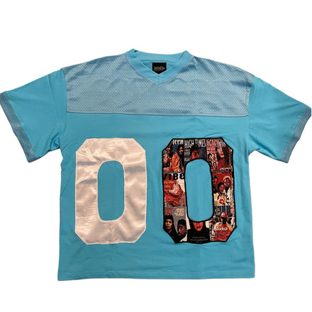 Light blue short-sleeved jersey with white ’00’’ numbers and a mesh shoulder yoke.