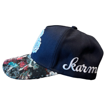 Dark blue baseball cap with floral brim.