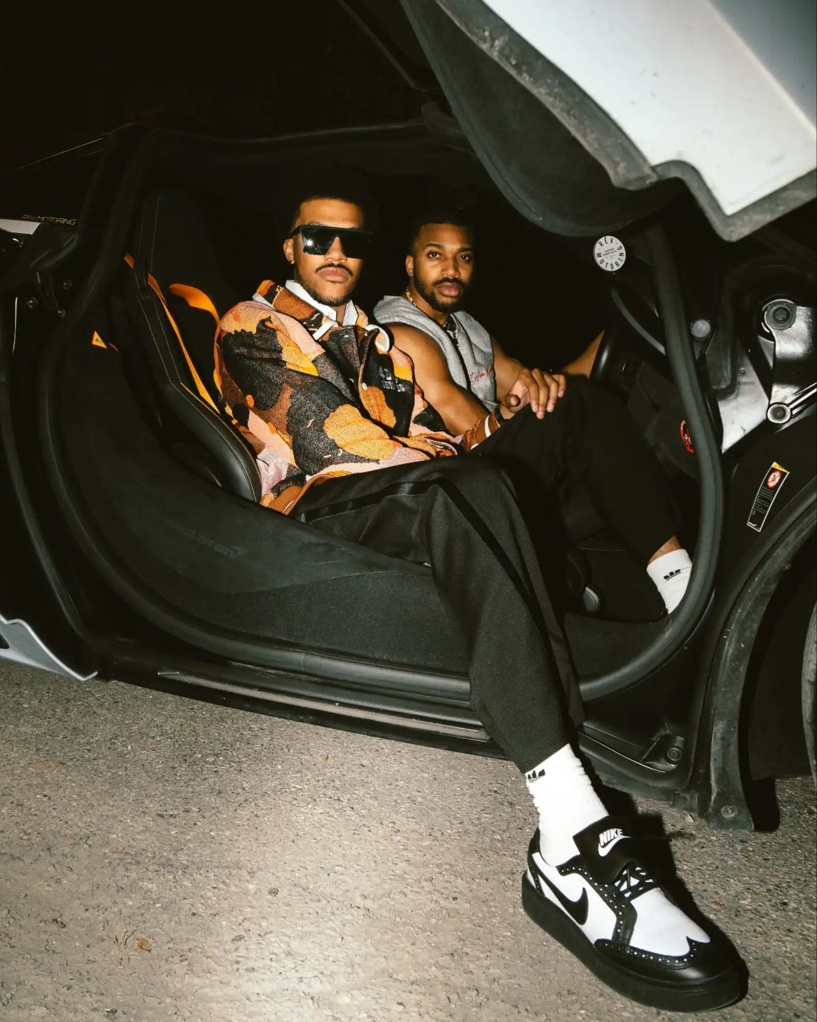 Black and white nike air jordan 1 high top sneakers with a classic design.