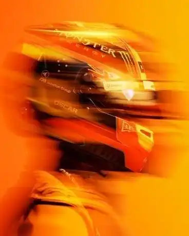 Monster energy drink canister with vibrant orange and yellow gradient background.